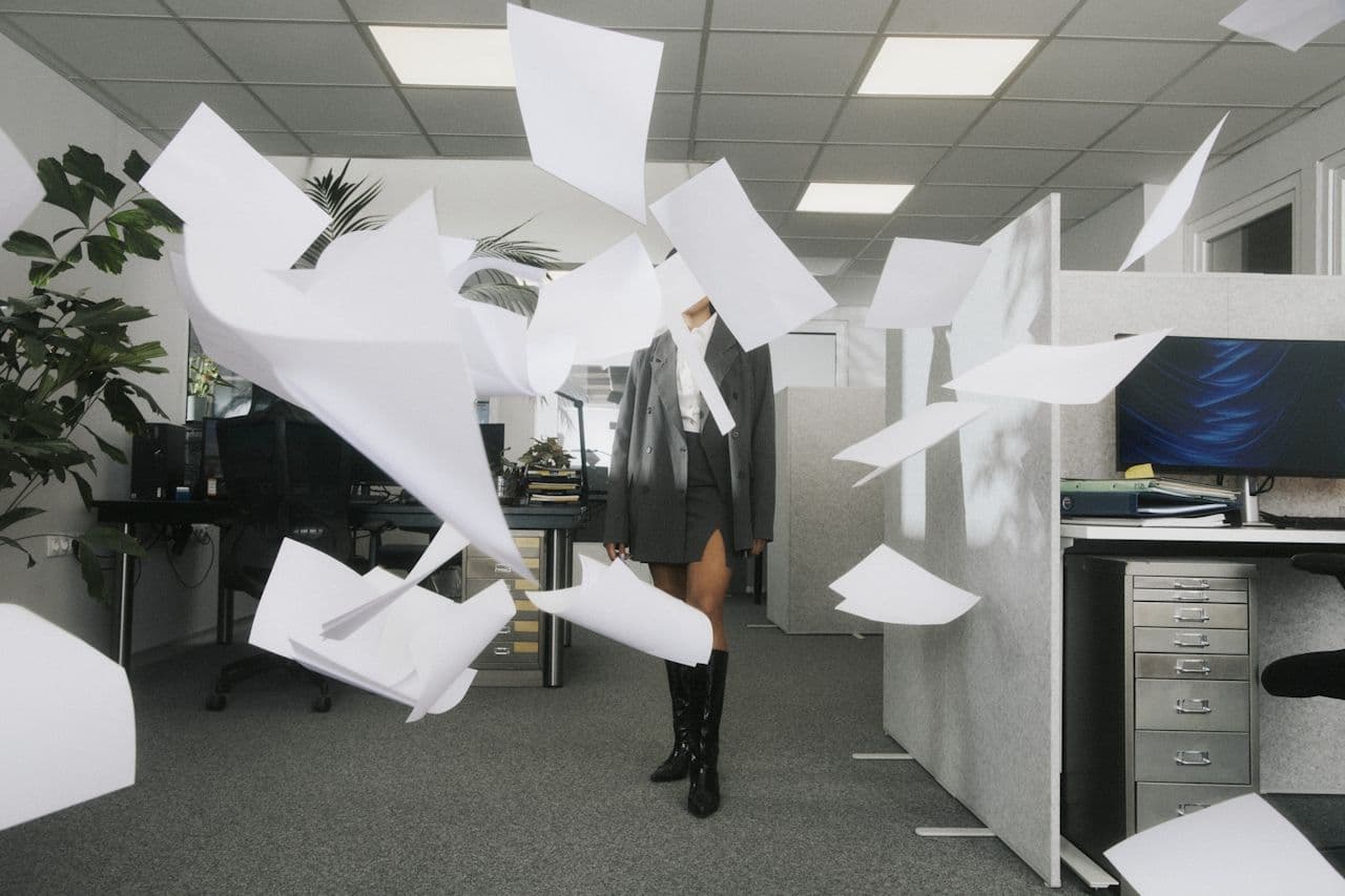 Woman with flying letters in the office